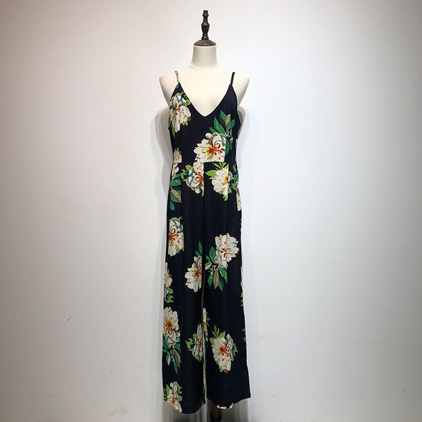 Salopetă cu decolteu adânc în V și bretele subțiri în albastru cu model