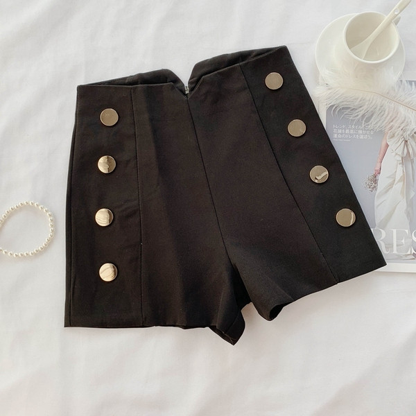 Pantaloni moderni de dama cu nasturi in alb si negru