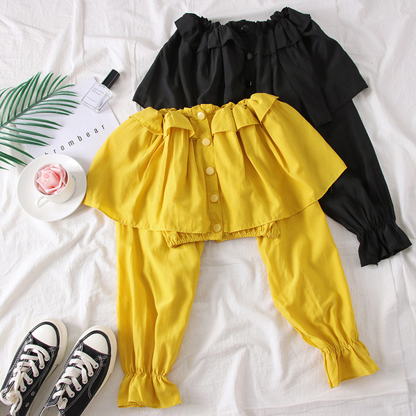 Bluză de damă elegantă cu umerii goi, în alb, negru și galben