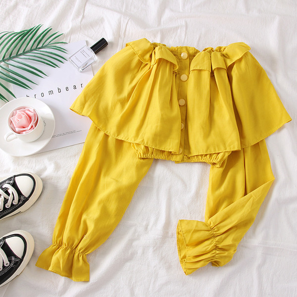 Bluză de damă elegantă cu umerii goi, în alb, negru și galben