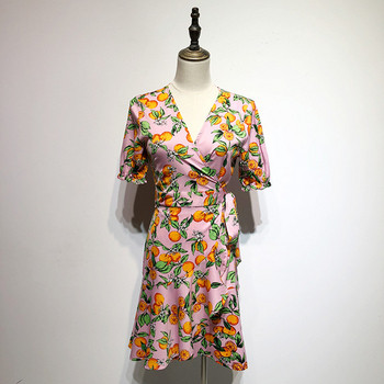 Rochie roz cu maneci scurte si cravate in talie cu model