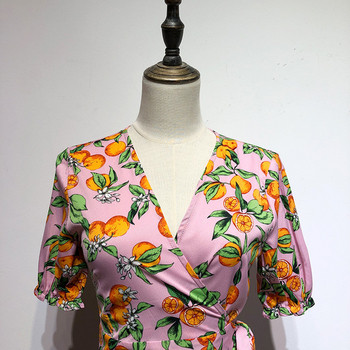 Rochie roz cu maneci scurte si cravate in talie cu model