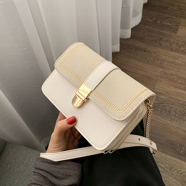 Geanta de dama moderna cu inchidere metalica in patru culori