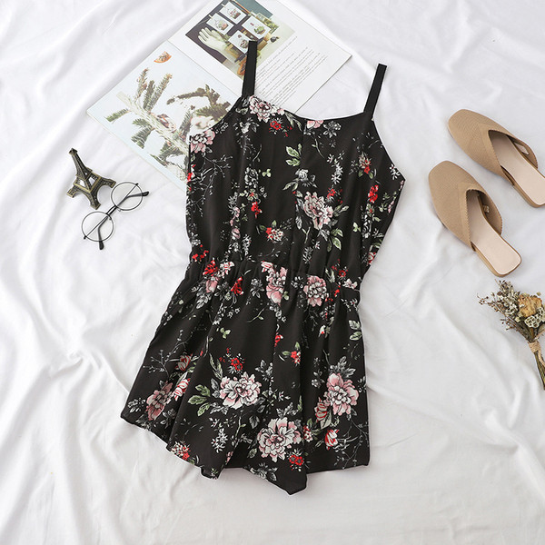 Alkalmi női overall vékony pánttal fekete színben, különböző mintákkal