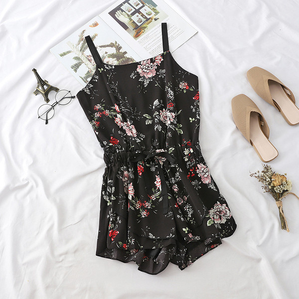 Alkalmi női overall vékony pánttal fekete színben, különböző mintákkal