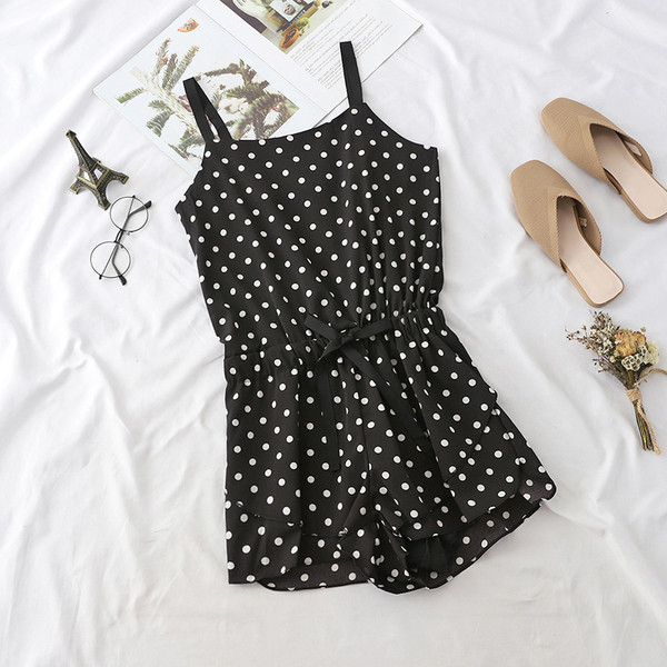 Alkalmi női overall vékony pánttal fekete színben, különböző mintákkal