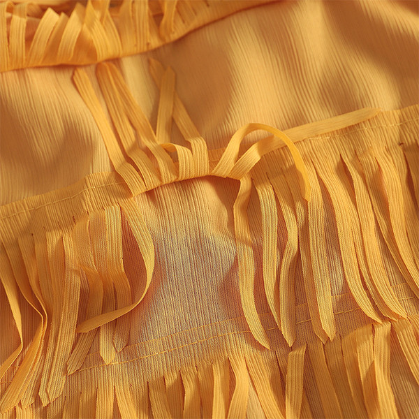 Modern női felső, széles pántokkal és rojtokkal több színben