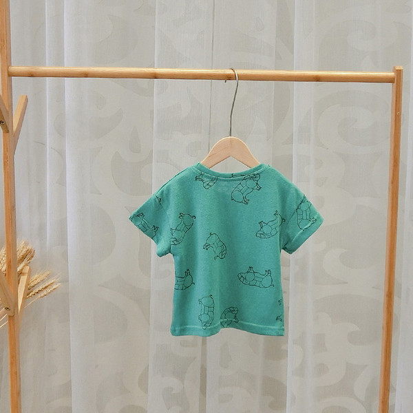 Zöld színű, O-nyakú gyerekpóló fiúknak