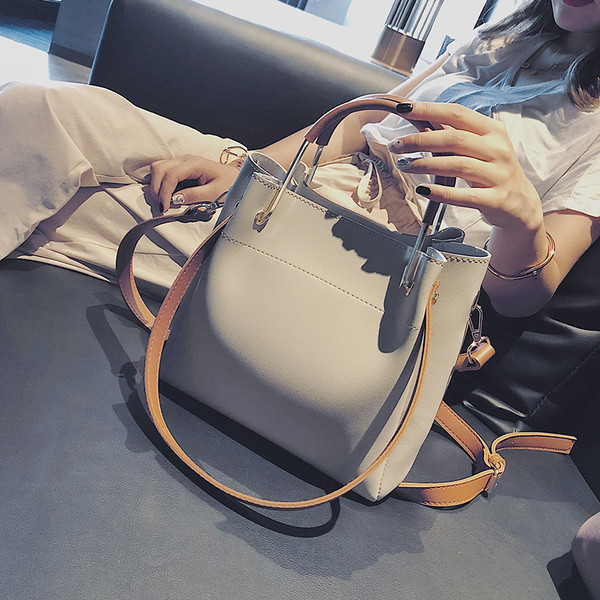 Eko bőrből készült alkalmi női táska rövid és hosszú füllel, több színben