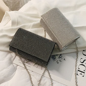 Elegáns női táska kövekkel fekete, ezüst és arany színben