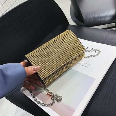 Elegáns női táska kövekkel fekete, ezüst és arany színben