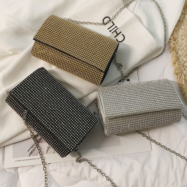 Elegáns női táska kövekkel fekete, ezüst és arany színben