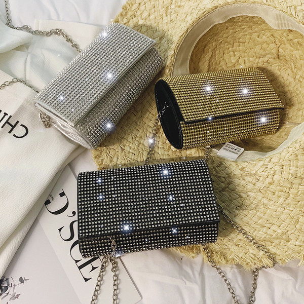 Elegáns női táska kövekkel fekete, ezüst és arany színben