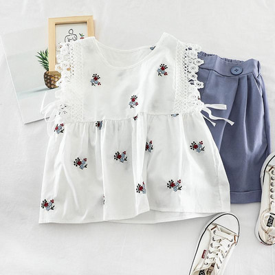 Modern női felső, hímzéssel