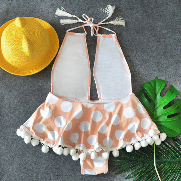 Pöttyös fürdőruha mély nyakkivágással