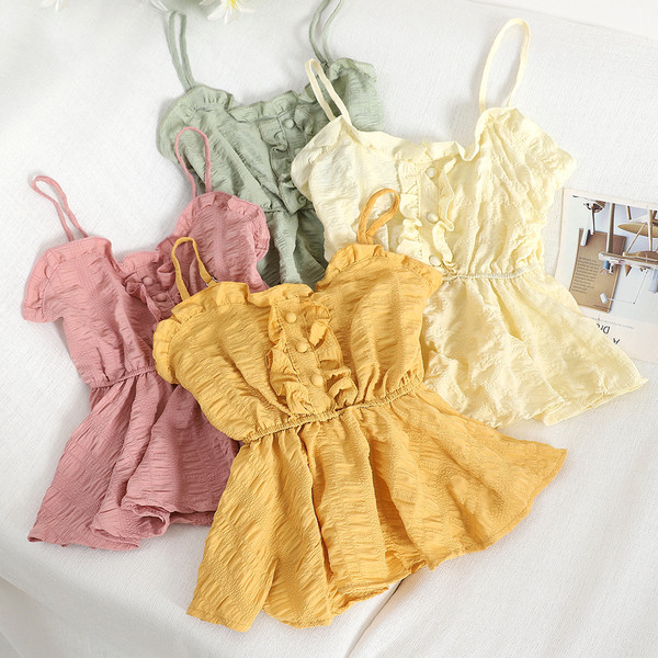 Modern női felső, vékony pántokkal és gombokkal, többféle színben