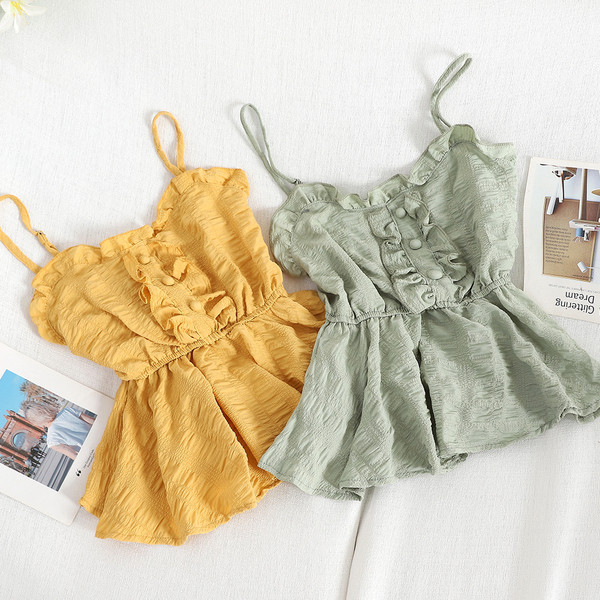 Modern női felső, vékony pántokkal és gombokkal, többféle színben