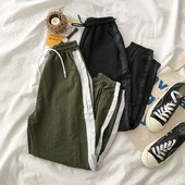 Női sportnadrág oldalsó szegéllyel, két színben