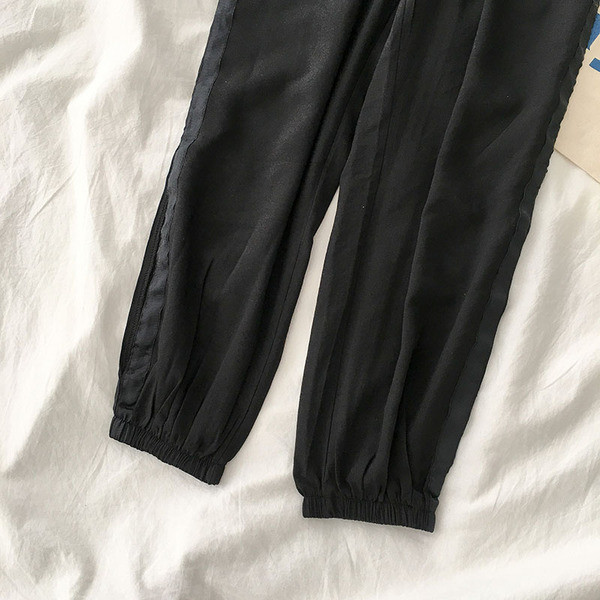 Női sportnadrág oldalsó szegéllyel, két színben