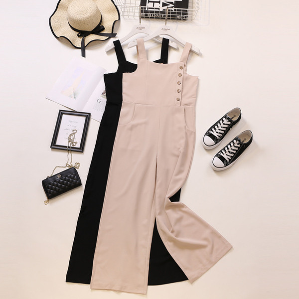 Modern női overál rózsaszín és fekete pántokkal