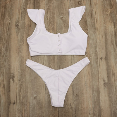 Kétrészes fürdőruha fehér és fekete gombokkal