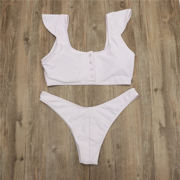 Kétrészes fürdőruha fehér és fekete gombokkal