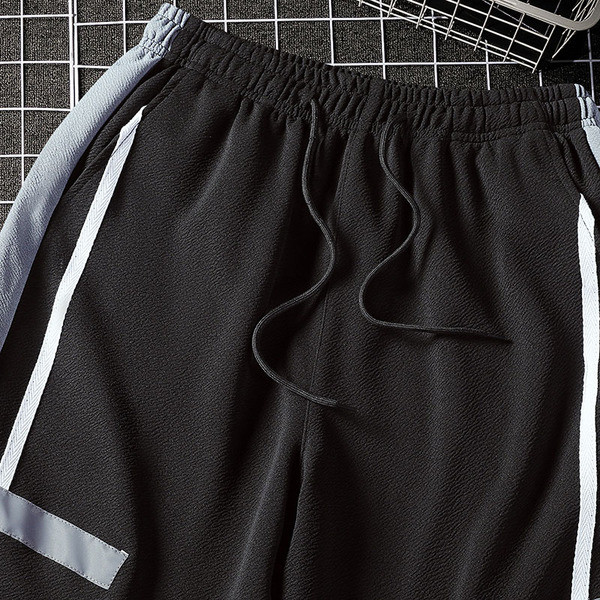 Férfi rövidnadrág fekete és szürke színben, zsebekkel