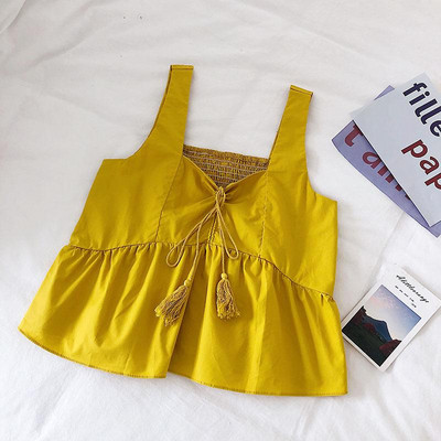 Modern női felső, bojttal és vastag pántokkal