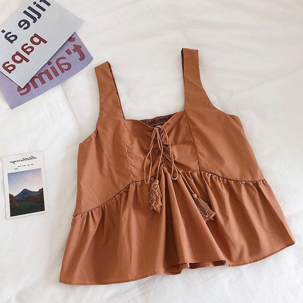 Modern női felső, bojttal és vastag pántokkal