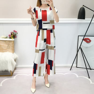 Casual women`s set of pants and blouse with color print
