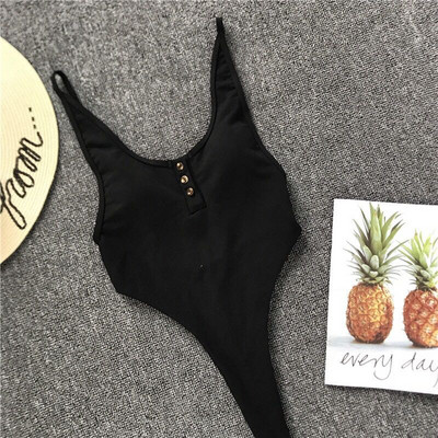 Teljes fürdőruha fekete, piros és fehér gombokkal