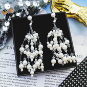 Fehér hosszú női fülbevaló gyöngyökkel