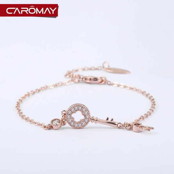 Női karkötő kövekkel és kulcsformával