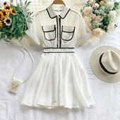 Κομψό γυναικείο φόρεμα με τσέπη και κοντό μανίκι σε λευκό και μαύρο χρώμα