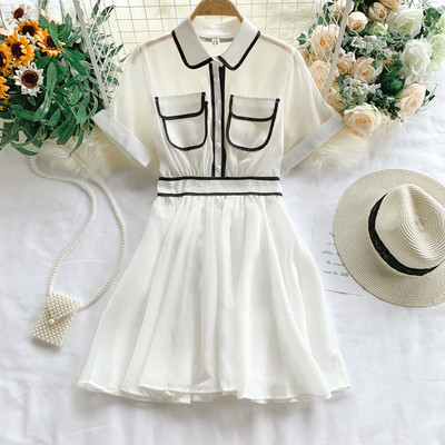 Κομψό γυναικείο φόρεμα με τσέπη και κοντό μανίκι σε λευκό και μαύρο χρώμα