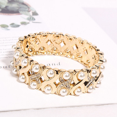 Bratara de dama de culoare aurie cu perle si pietre