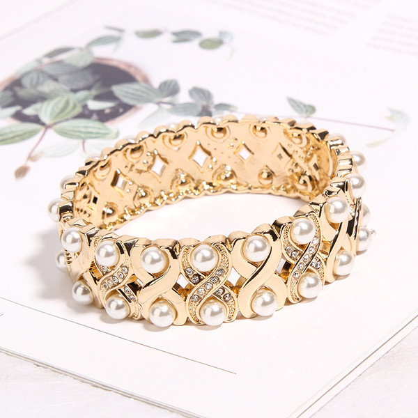 Bratara de dama de culoare aurie cu perle si pietre