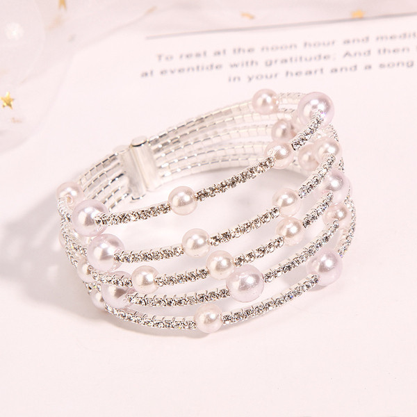 Дамска гривна в два цвята с камъни и перли