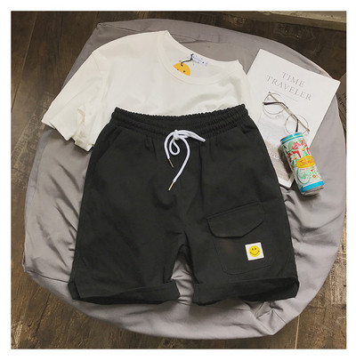 Alkalmi férfi rövidnadrág zsebbel és rátéttel több színben