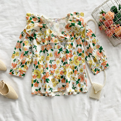 Μοντέρνα γυναικεία μπλούζα με κουμπιά και φυτικά μοτίβα