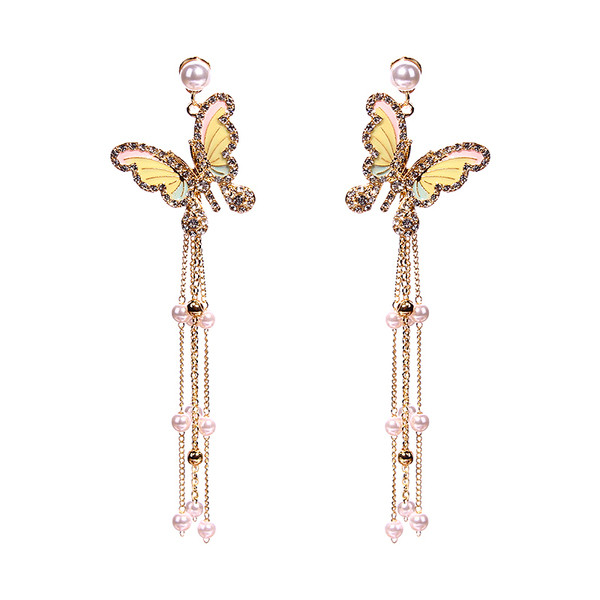 Stílusos női fülbevaló díszítő kövekkel és gyöngyökkel