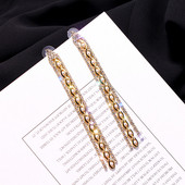 Hosszú, arany színű női fülbevaló