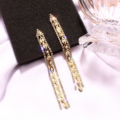 Hosszú, arany színű női fülbevaló