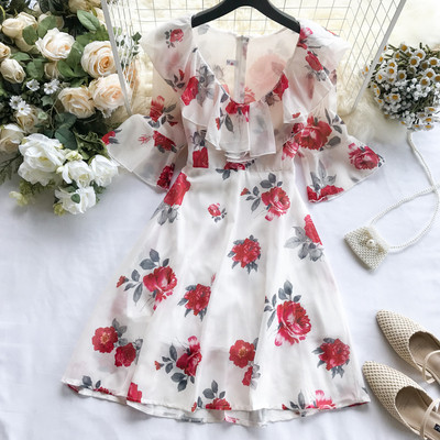 Καλοκαιρινό γυναικείο  φόρεμα σε λευκό με floral μοτίβα