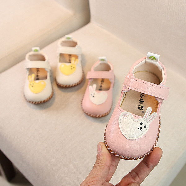 Fehér és rózsaszín babacipő lányoknak