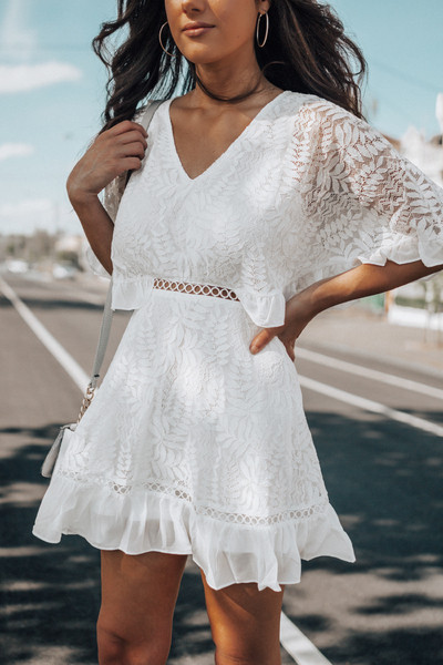 Modern women`s lace dress in white