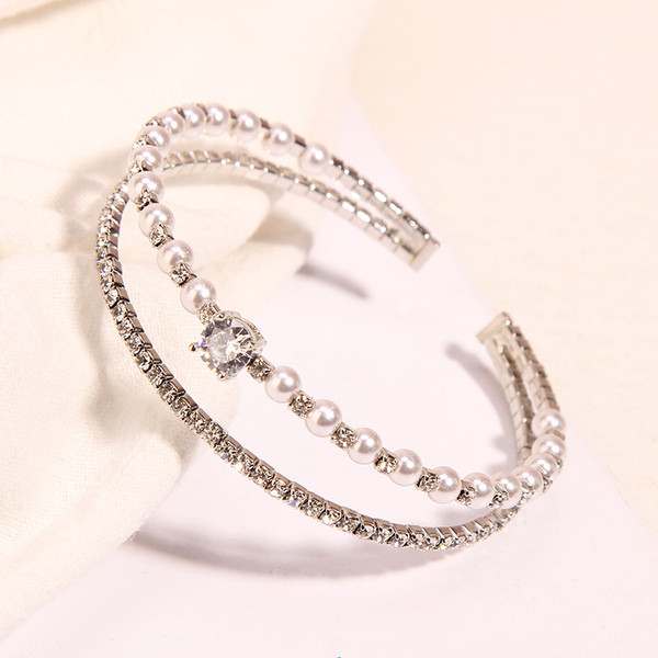 Modern karkötő két színben kövekkel és gyöngyökkel