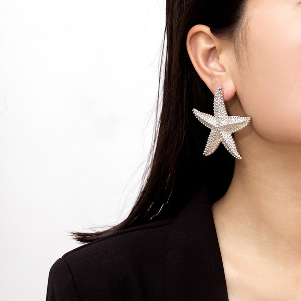 Cercei de dama actuali in forma de stea din aur si argint