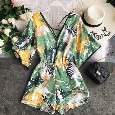 Salopetă de damă elegantă, cu model floral și decolteu în V