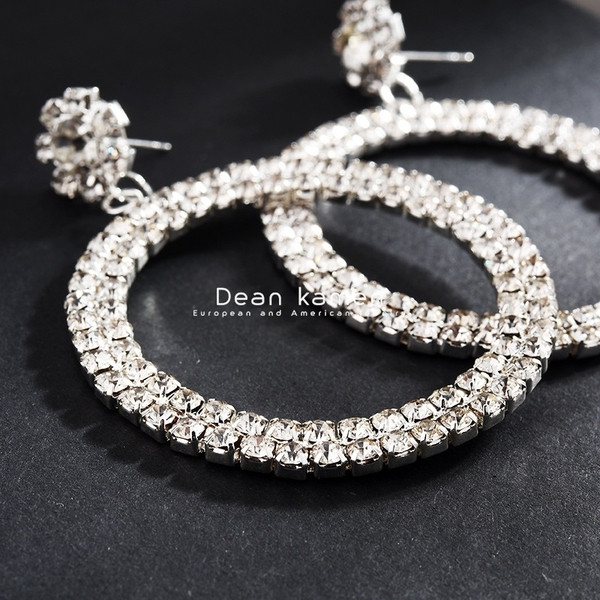 Cercei eleganti de dama in forma rotunda si un element din pietre